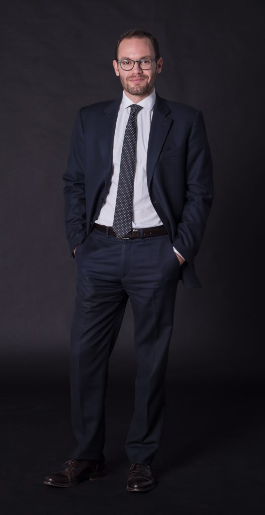 Raúl González standing with black background